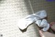 A pair of white socks sitting on top of a carpet.